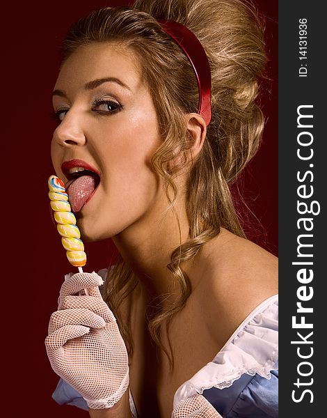 Lollipop. Pin up studio woman's portrait