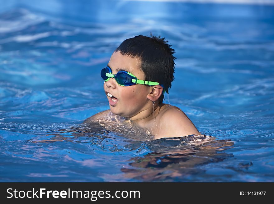 Young boy swimming close up