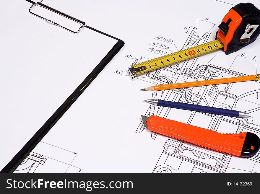 Office knife, pen and tape measure at form