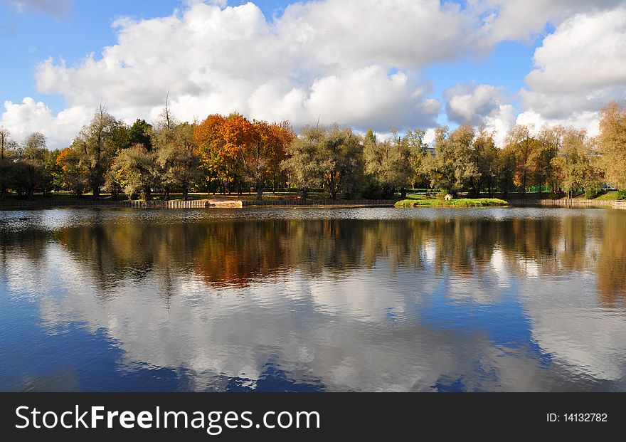 Autumn trees are reflected in water. Autumn trees are reflected in water.