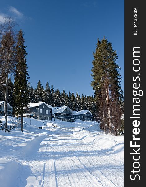 Cottages in winter forest. Finland.