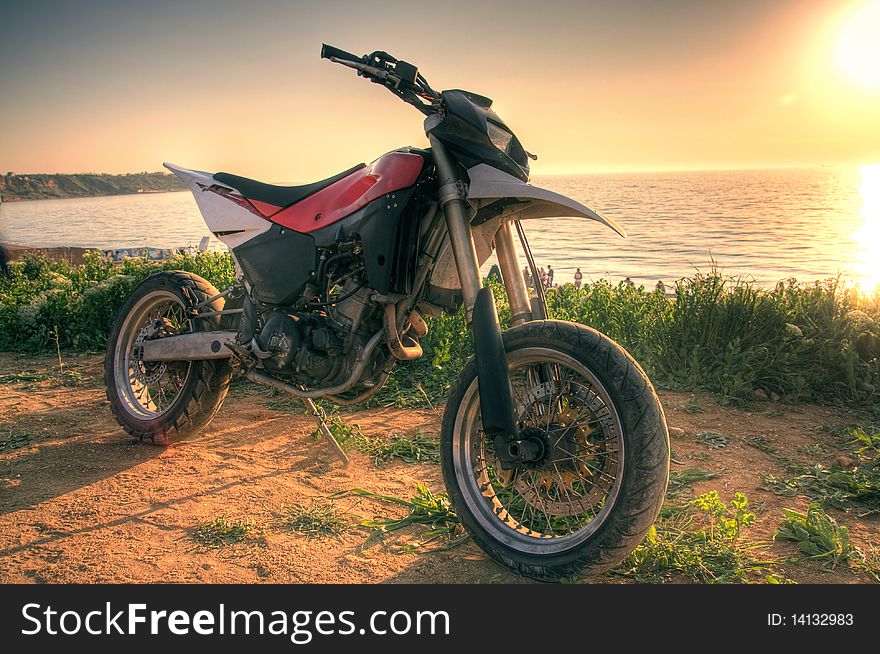 Motorcycle enduro class at sunset on the beach. Motorcycle enduro class at sunset on the beach