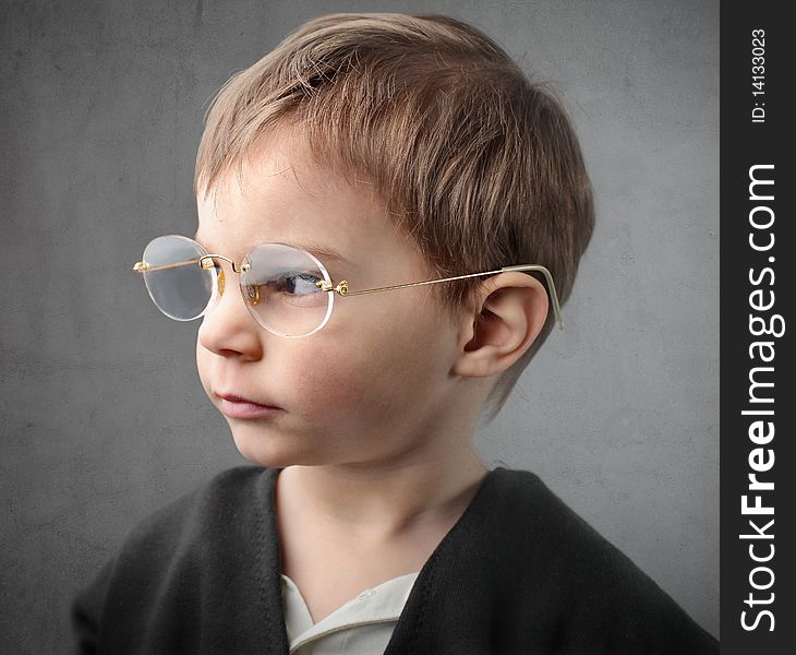 Profile of a child wearing glasses
