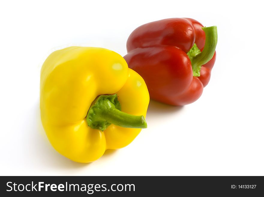 Red and yellow pepper on a white background. A photo close up