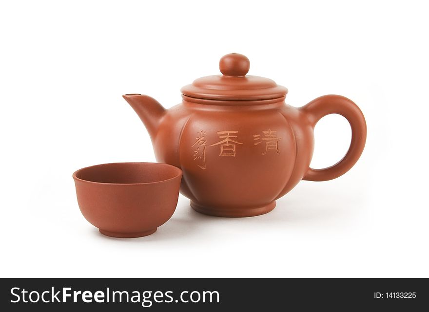 Chinese teapot and cup on a white background