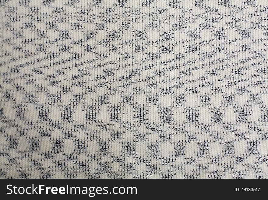 Knitted pattern as a background. Knitted pattern as a background