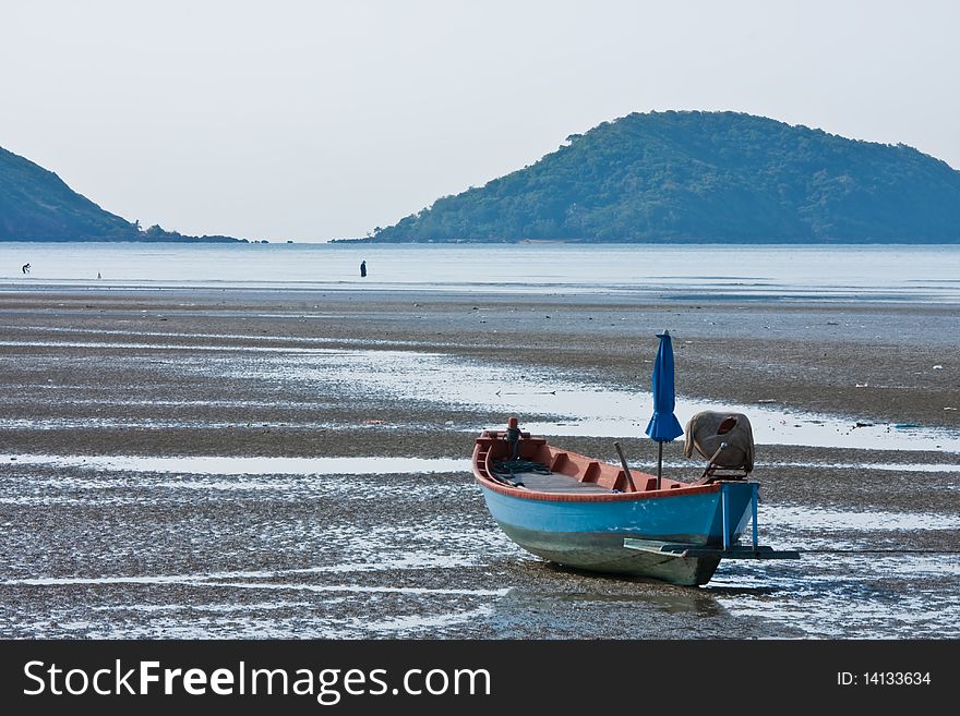 Blue boat of fisherman on beach