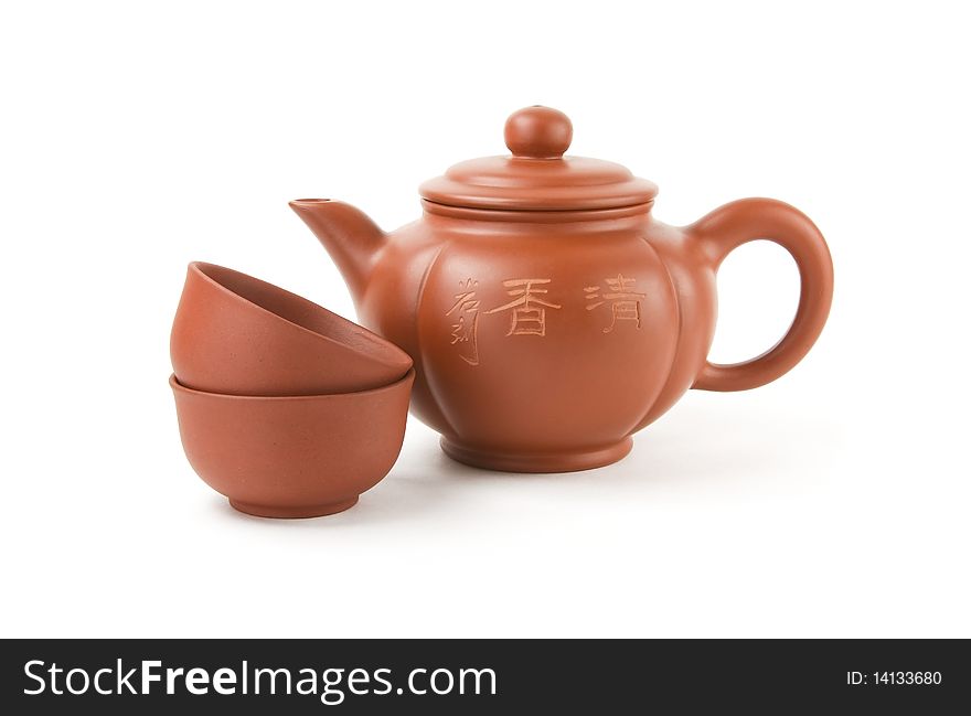Chinese teapot and two cups on a white background