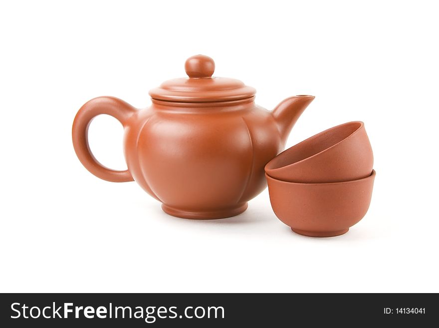 Chinese teapot and two cups on a white background