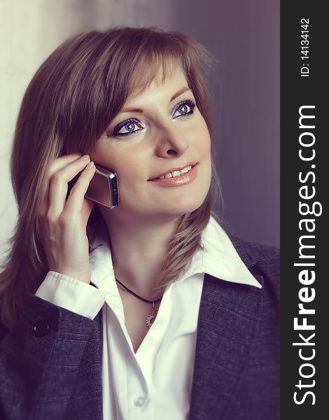 Beautiful businesswoman speaking on the phone
