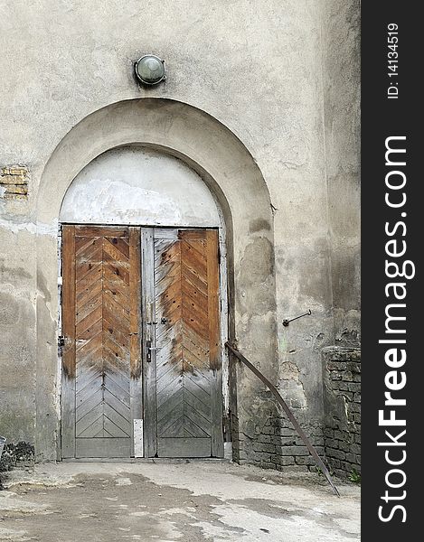 Entrance in old psychiatric hospital, old wooden door