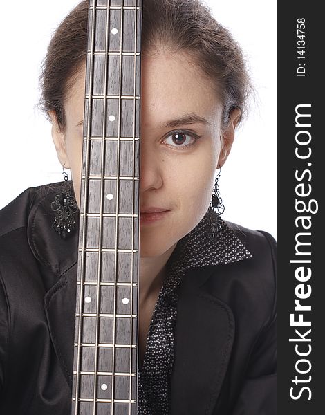 Young woman posing in studio with a black electric bass guitar. Isolated on white background. Young woman posing in studio with a black electric bass guitar. Isolated on white background