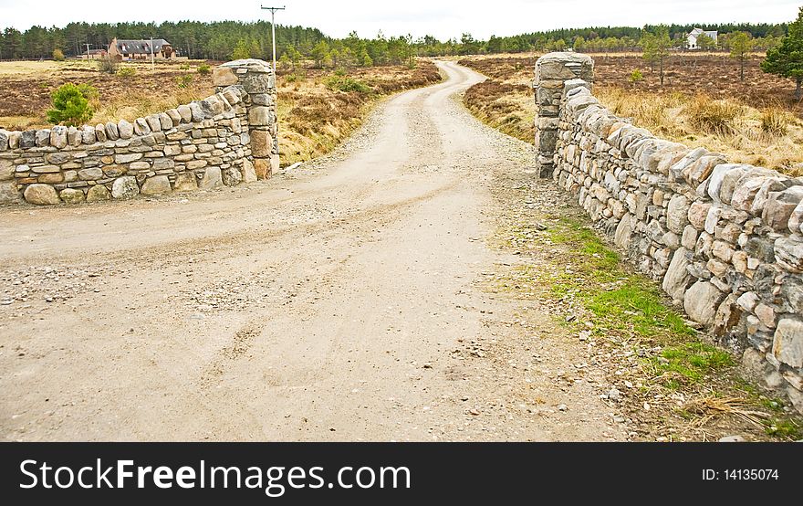 An image of  stone walls built to enhance the entrance to a house in the hills. An image of  stone walls built to enhance the entrance to a house in the hills.
