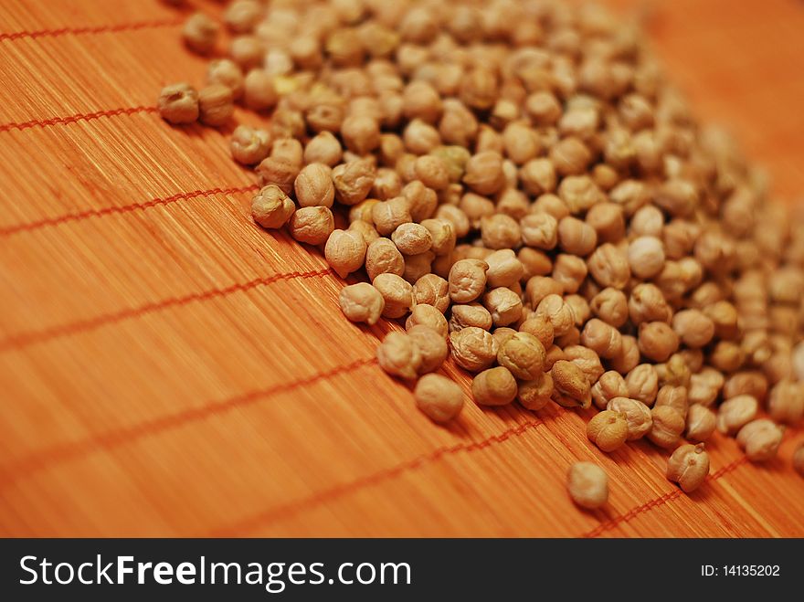 Chickpea grains over bamboo mat