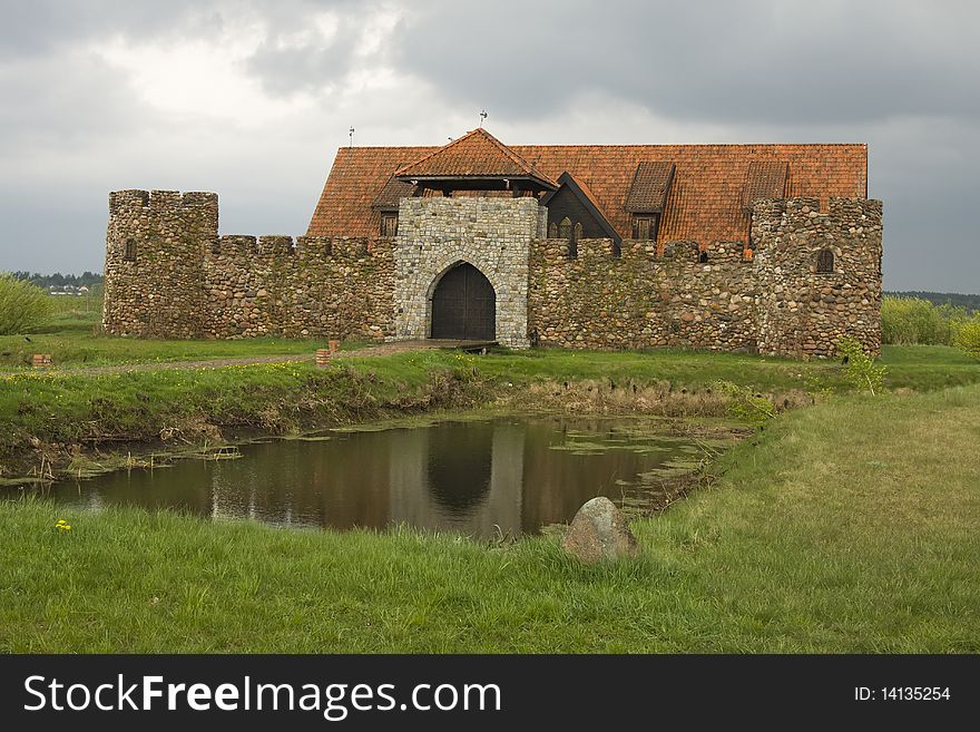 Small old style castle on pond. Small old style castle on pond