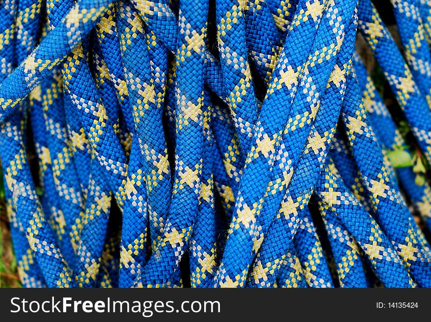 Blue climbing rope, abstract background