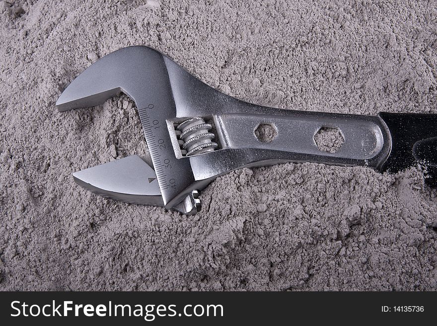 Adjustable Wrench on gray background