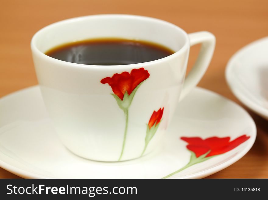 Black coffee in beautiful cup with red flower. Black coffee in beautiful cup with red flower