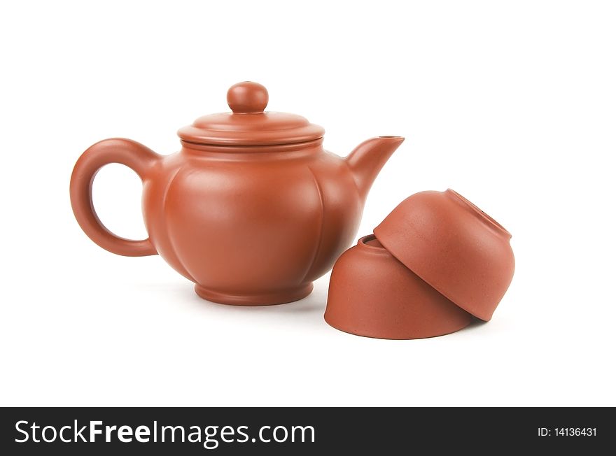 Chinese teapot and two cups on a white background