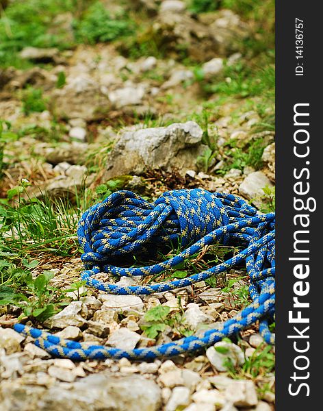 Blue climbing rope on the ground