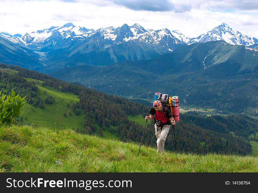 Hiker boy in Caucasus mountains