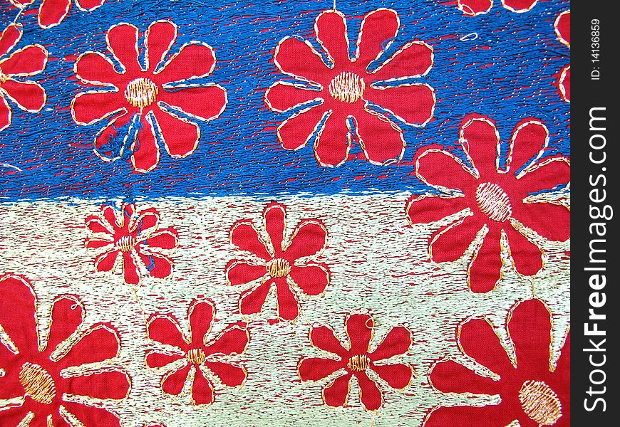 Indian hand embroidery fabric with silk thread on cotton material.