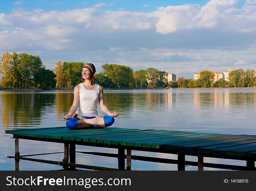 Female doing yogatic exericise in nature