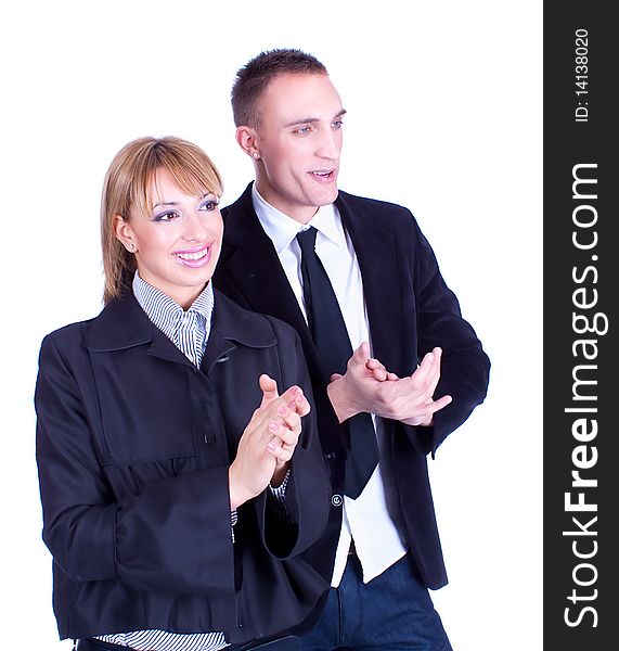 Young business woman and business man clapping hands. Studio shot