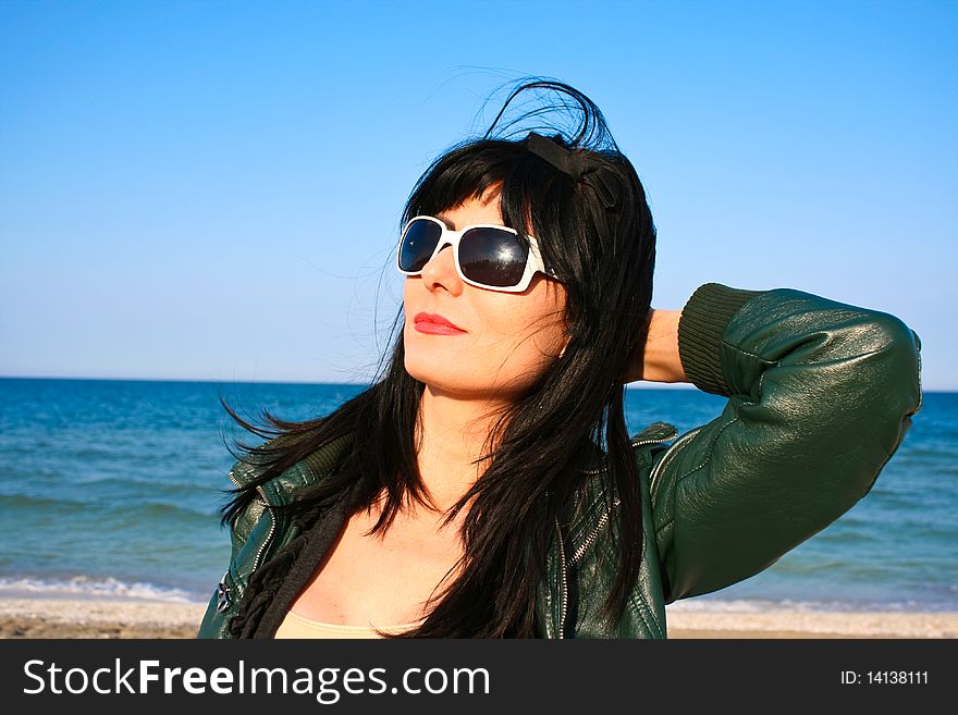 Woman sun bathing on the beach