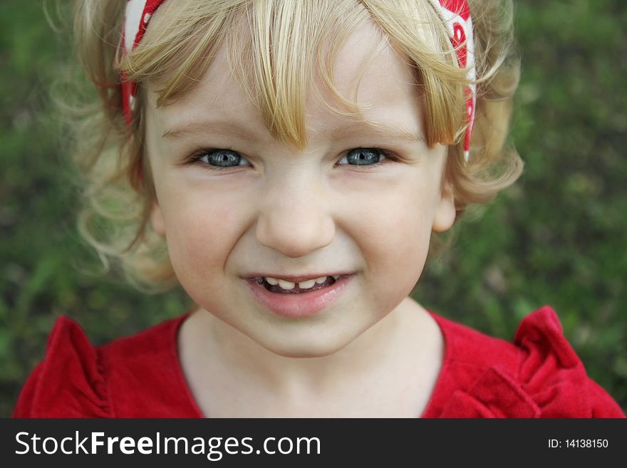 Portrait of a little blue-eyed girl on walk