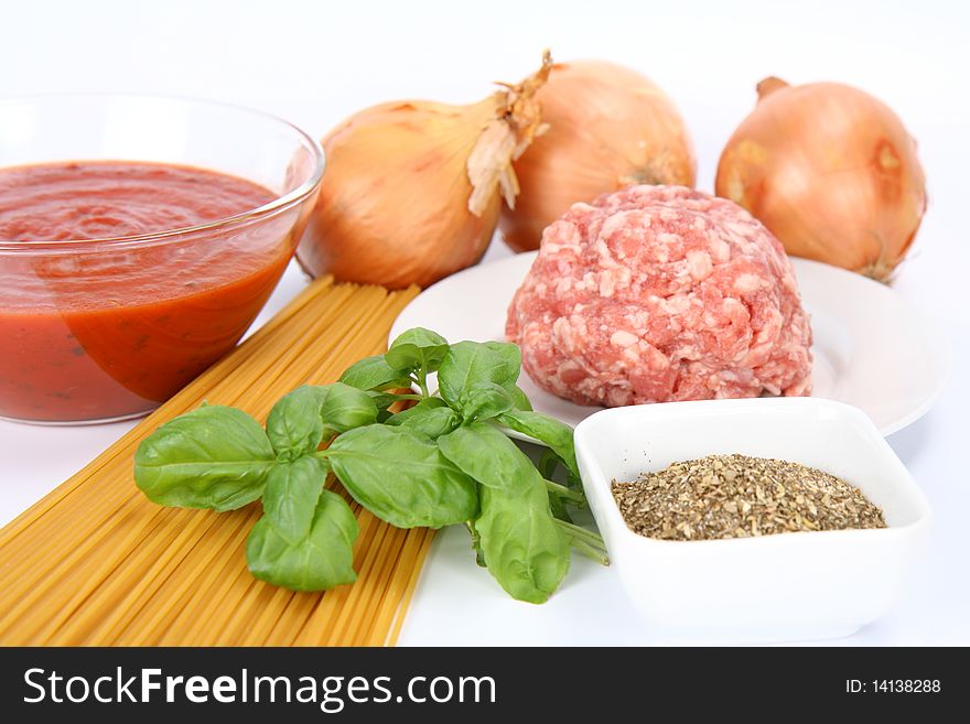 Ingredients for spaghetti bolognese on white background