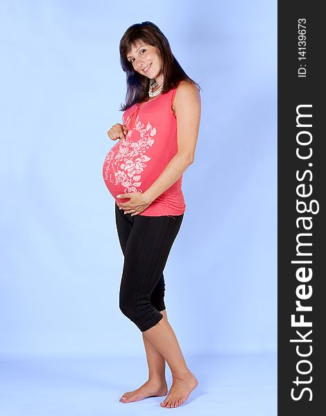 Pregnant female on blue background