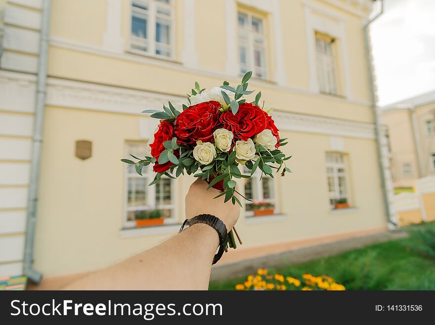 Wedding Fresh Bouquet In A Man`s Hand.