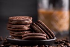 Chocolate Chips Cookies On Black Background. Latte Coffee On Background. Royalty Free Stock Photo