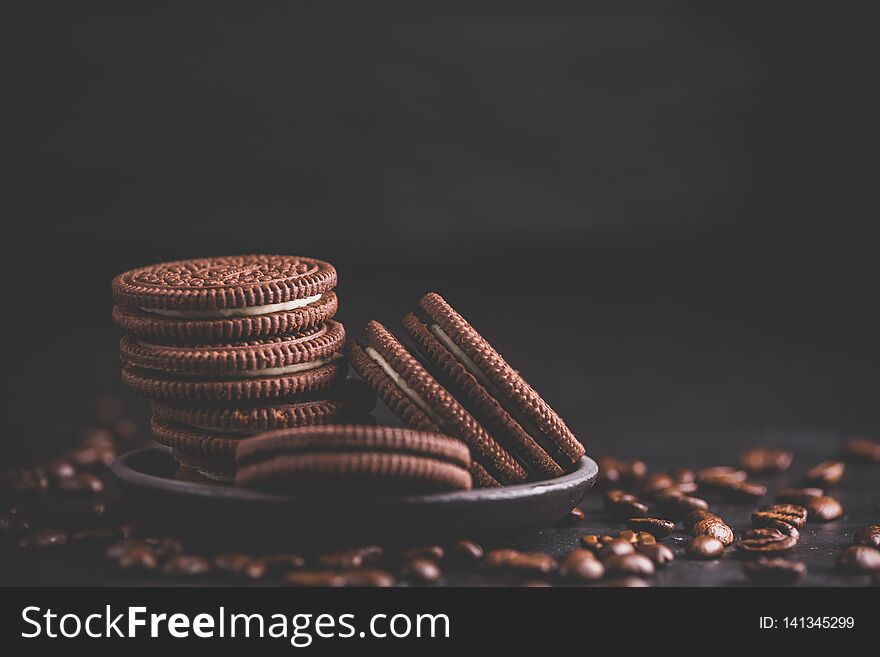 Chocolate chips cookies on black background. Matte toned