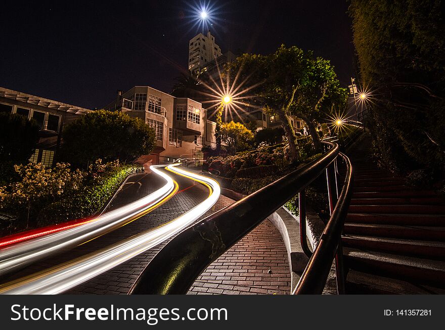 Car trails at night at Lomard Street, San Francisco