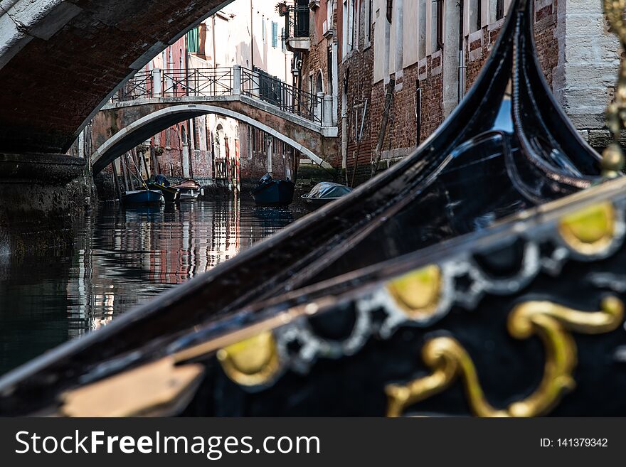 A vew from a Venetian Gondola as it navigates the back canals of Venice. A vew from a Venetian Gondola as it navigates the back canals of Venice