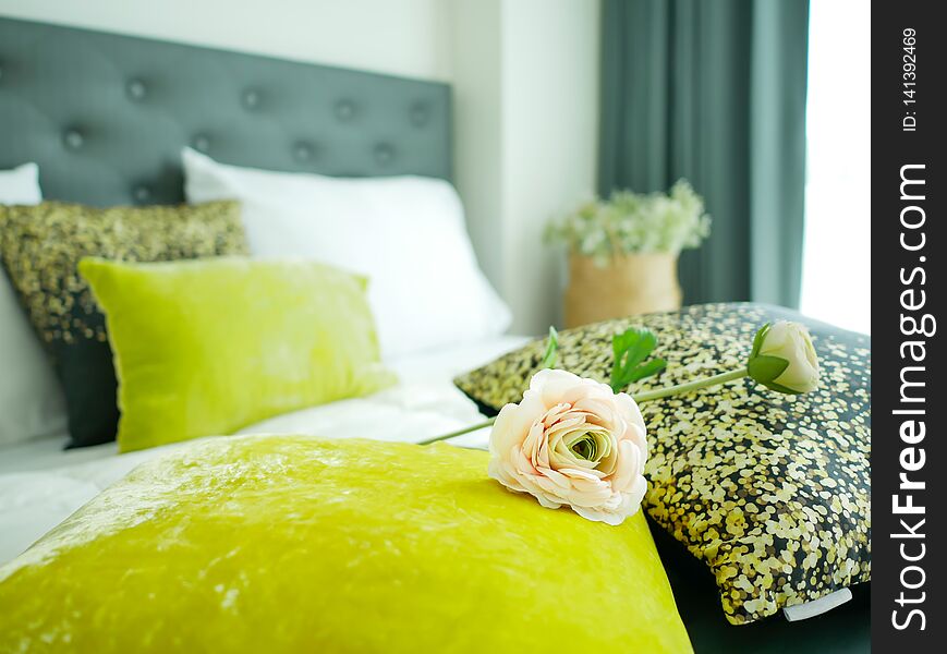 Romantic Bedroom, Closeup Pink Rose And Colorful Pillows On White Bed