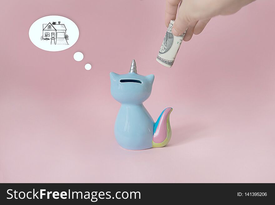Ceramic Souvenir Toy Money Box Kitten Korn Blue With Colorful Rainbow Tail With Unicorn Horn On Pink Background In