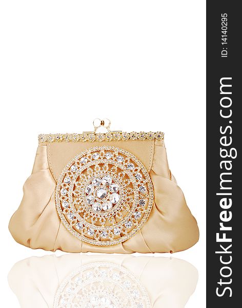 This is a beautiful ladies fancy golden clutch purse isolated on a white background.