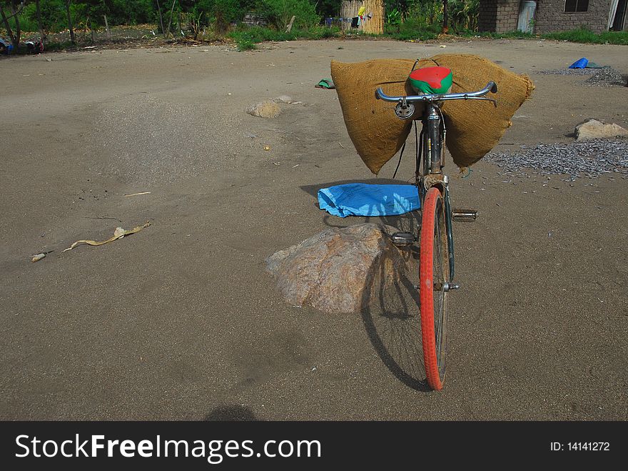 Old bicycle loaded with bag