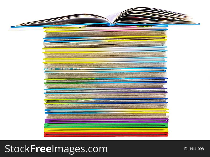 Pile of bright thin books isolated on white background. Pile of bright thin books isolated on white background