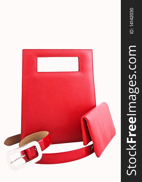 Set of red female leather accessories isolated on white background. Set of red female leather accessories isolated on white background