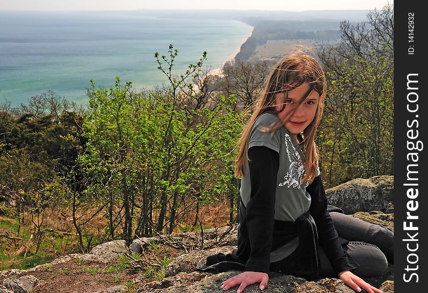 Portrait of pretty teenager on the hill