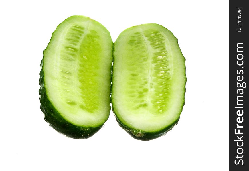 Two parts green cut in share juicy cucumber friend near friend on white background. Two parts green cut in share juicy cucumber friend near friend on white background