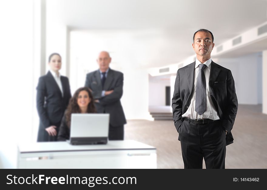 Japanese businessman with group of business people on the background. Japanese businessman with group of business people on the background