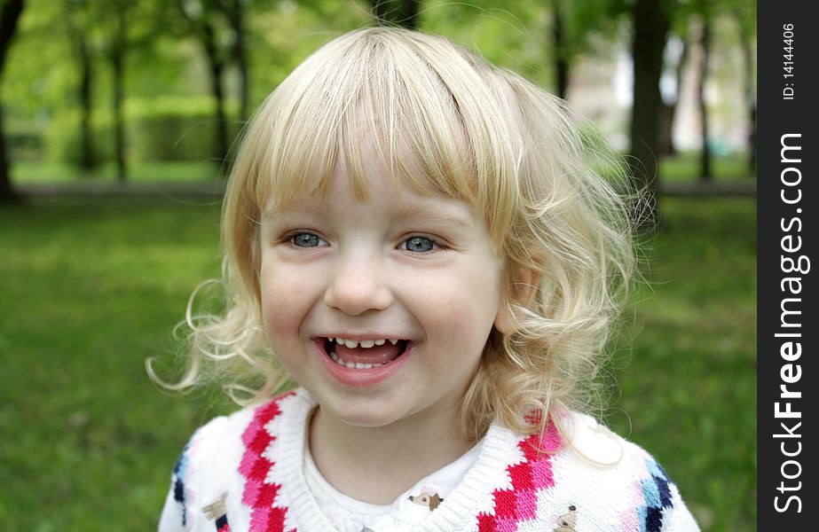 Portrait of a little blue-eyed girl on walk