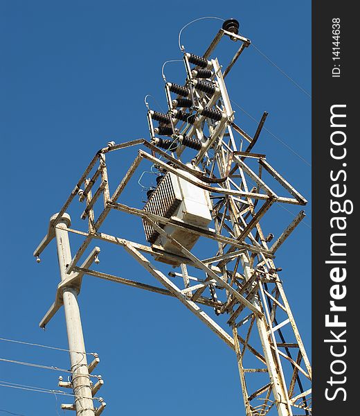 Old style metal electricity and telephone pole. Old style metal electricity and telephone pole