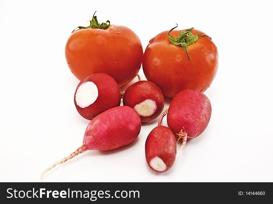 Tomatoes and radishes on white background, vegetables. Tomatoes and radishes on white background, vegetables