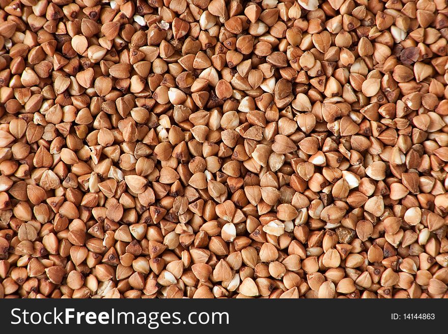 Background of dry raw buckwheat. Background of dry raw buckwheat